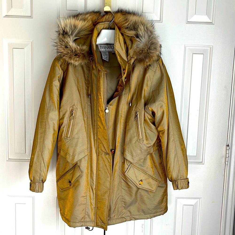 Metallic gold parka with faux fur lined hood.